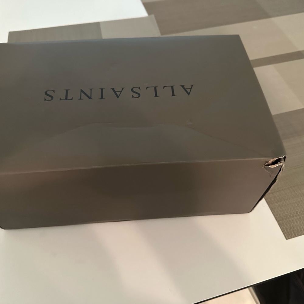 All Saints used box some tears but still good condition